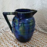 Antique pitcher in enamelled ceramic