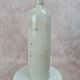 Antique beige glazed stoneware bottle from the 19th century, with a handle, vintage decor.