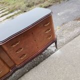 Mid-century Italian brown wooden chest of drawers, black glass top and brass handles.
