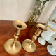 Pair of brushed brass candle holders