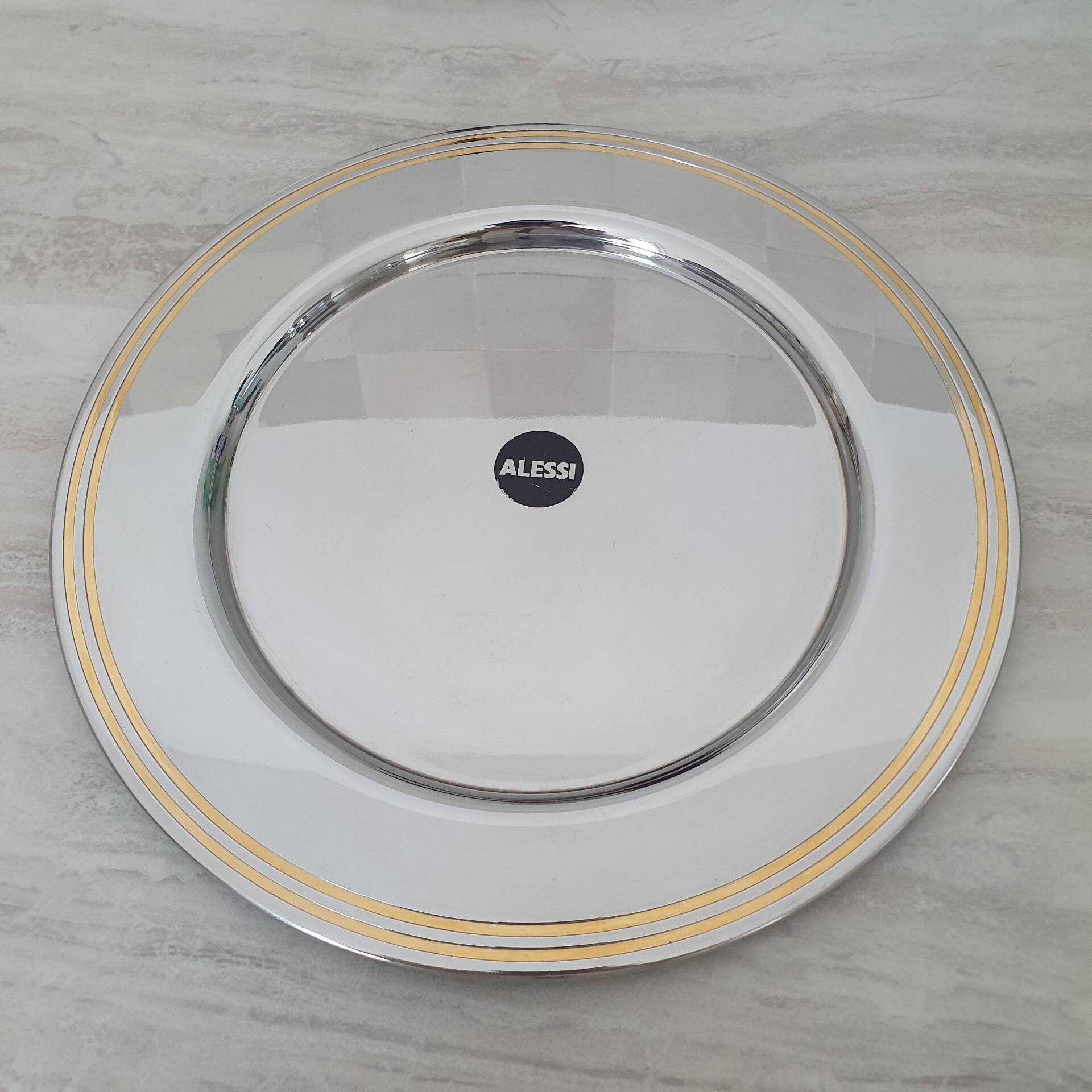 Alessi Ettore Sottsass / Serving plate in stainless steel 18/10 and gold NG5100