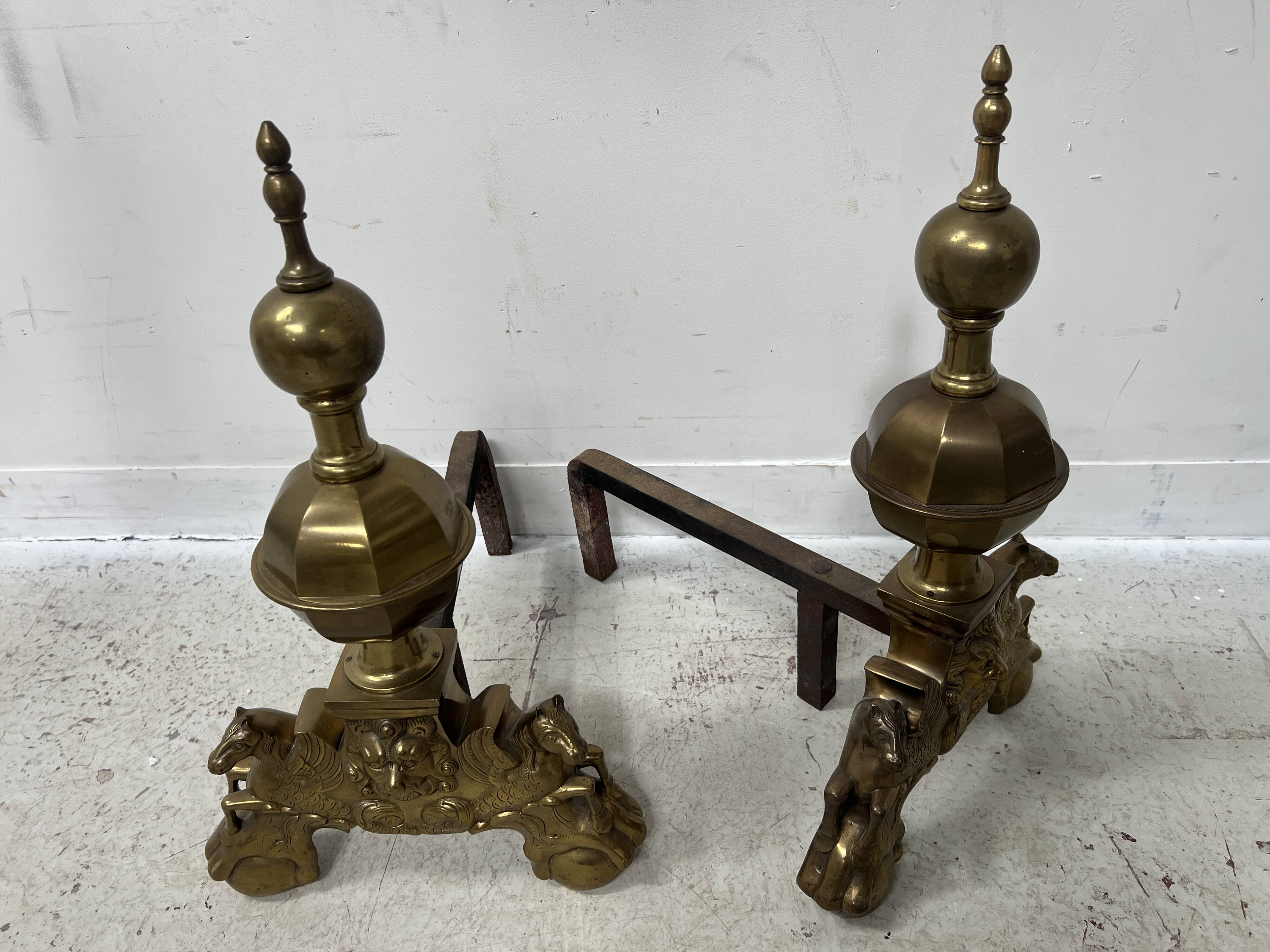 Important pair of brass log holders from the 20th century.