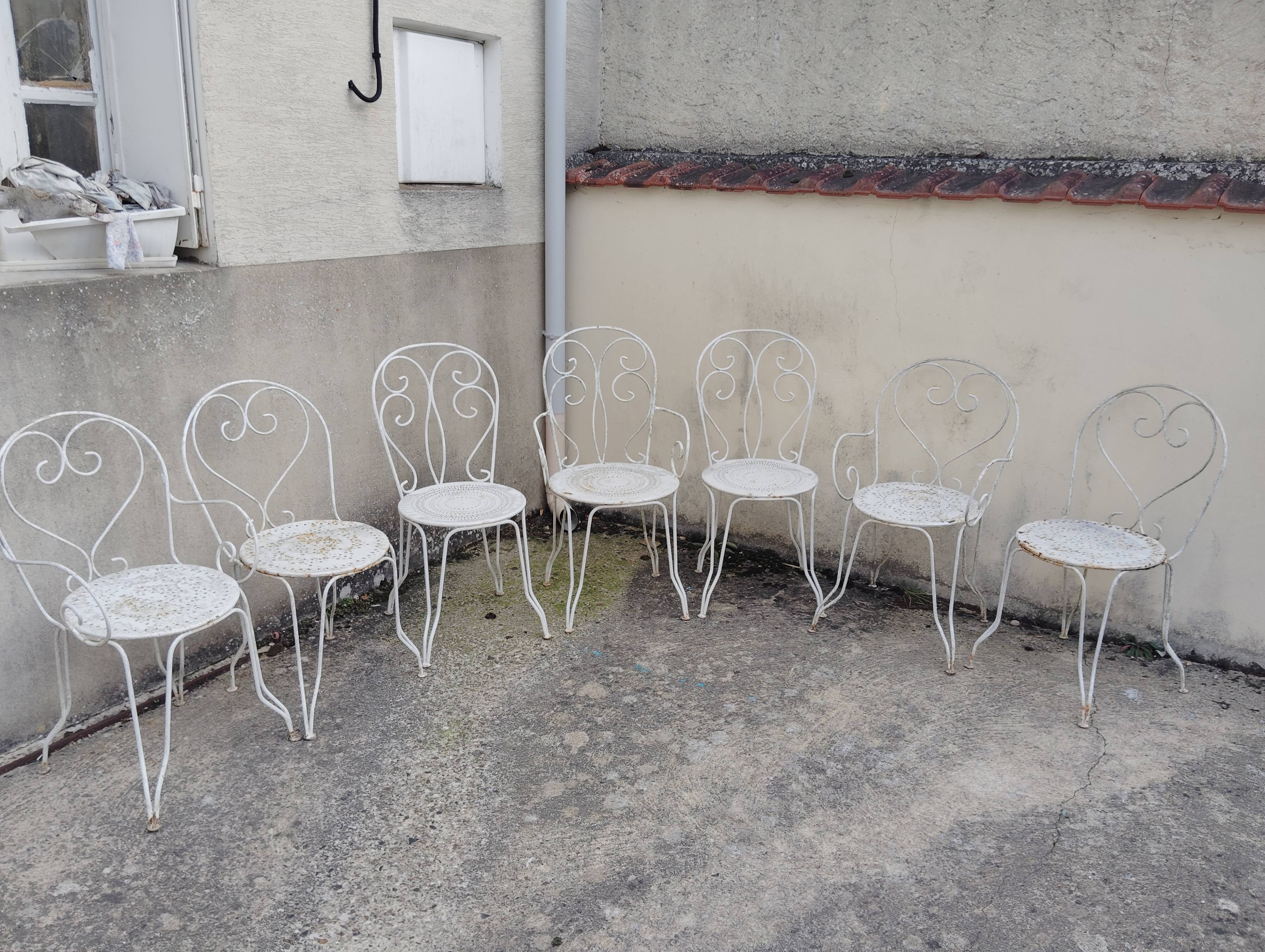 Wrought iron garden furniture from the early 20th century.