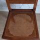 Art Deco caned chair with bronze ornaments.
