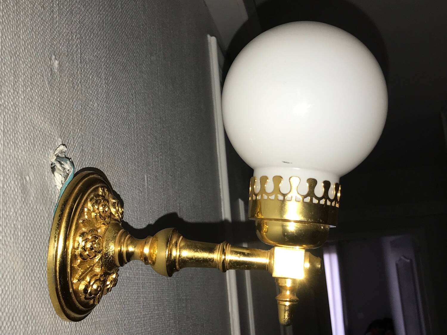 Brass and opal glass wall lights