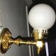 Brass and opal glass wall lights