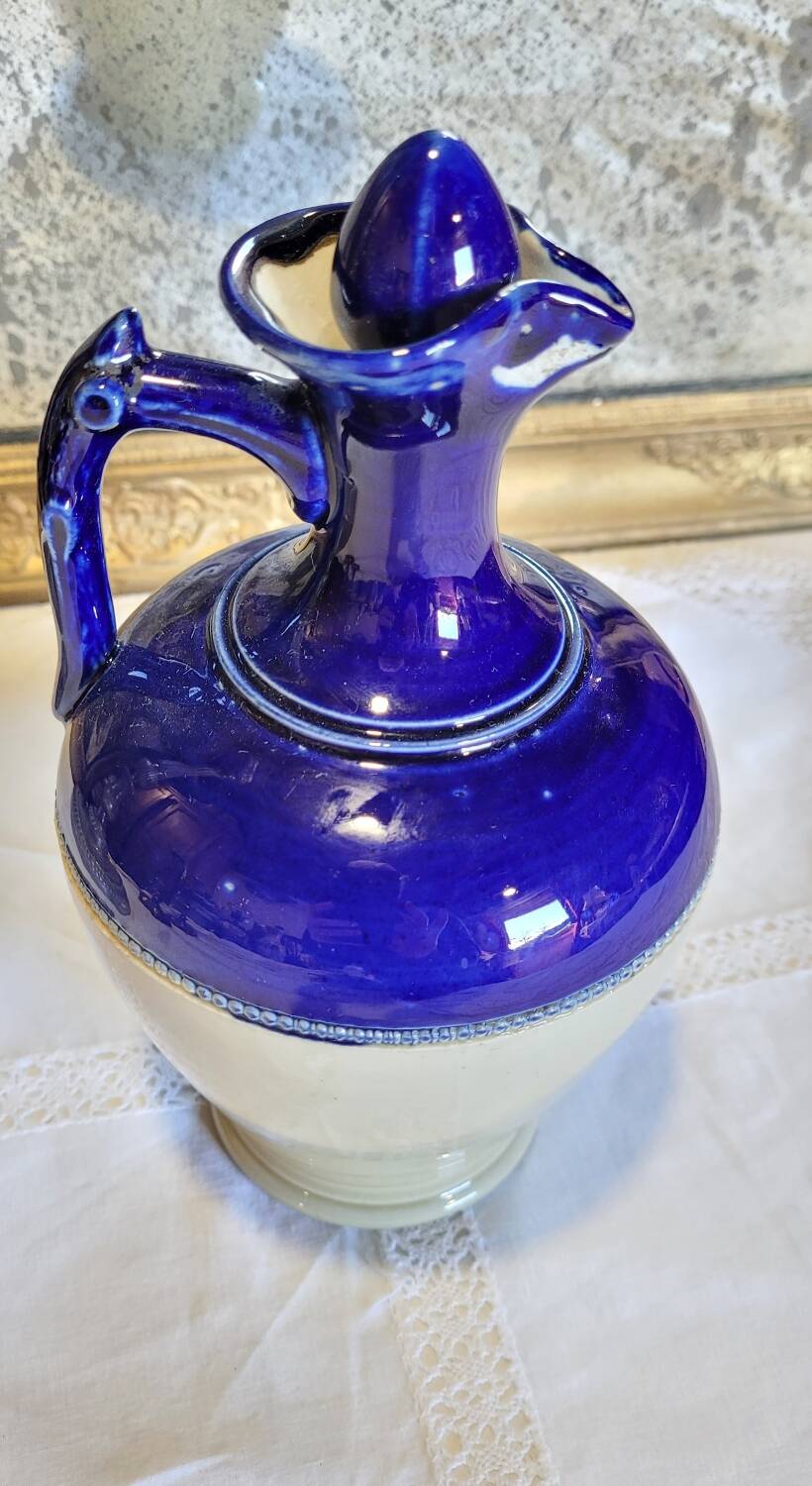 Antique iron-rich earth bottle from Saint Uze, ceramic carafe jug.