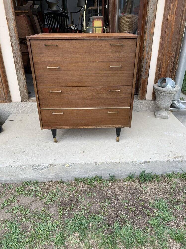 Mid-century teak chest of drawers in brown with four drawers, brass handles, 1960s.