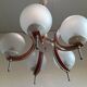 Scandinavian suspension in teak, glass, and metal.