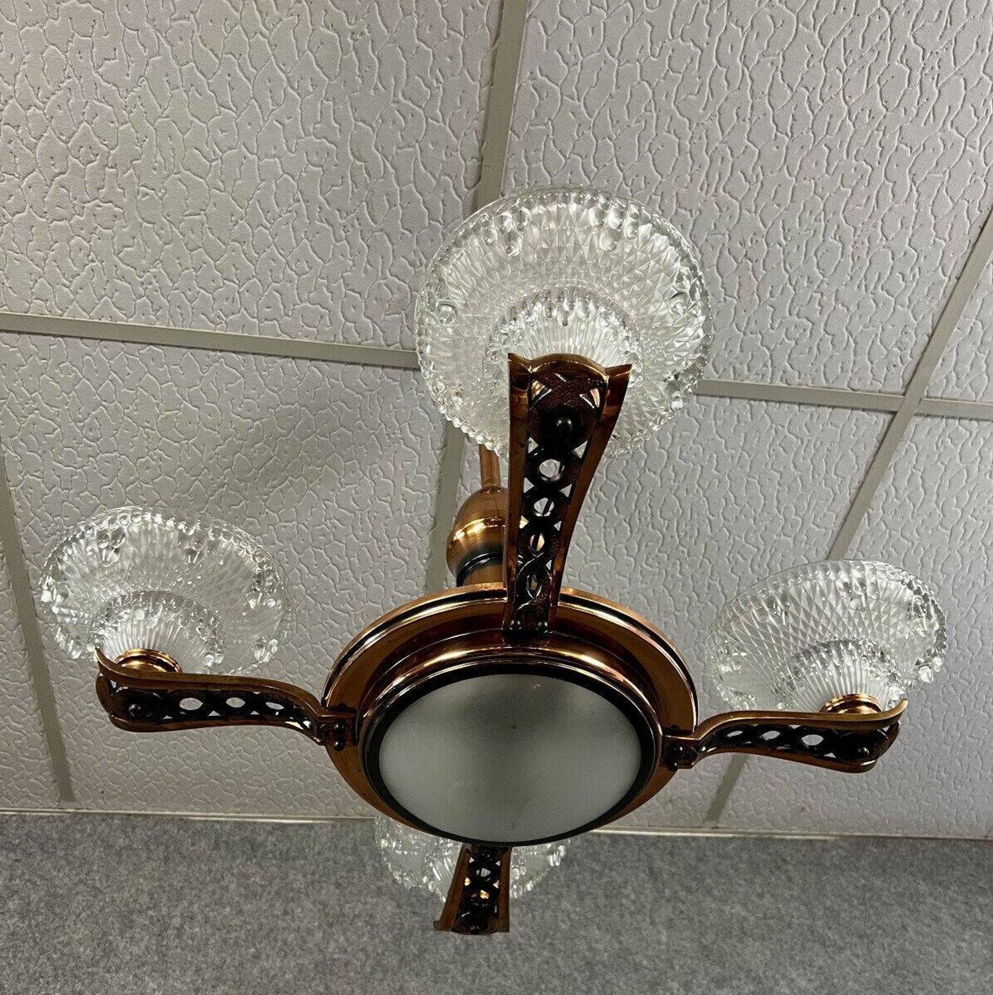 Art Deco period chandelier in copper-plated brass and molded pressed glass, circa 1940