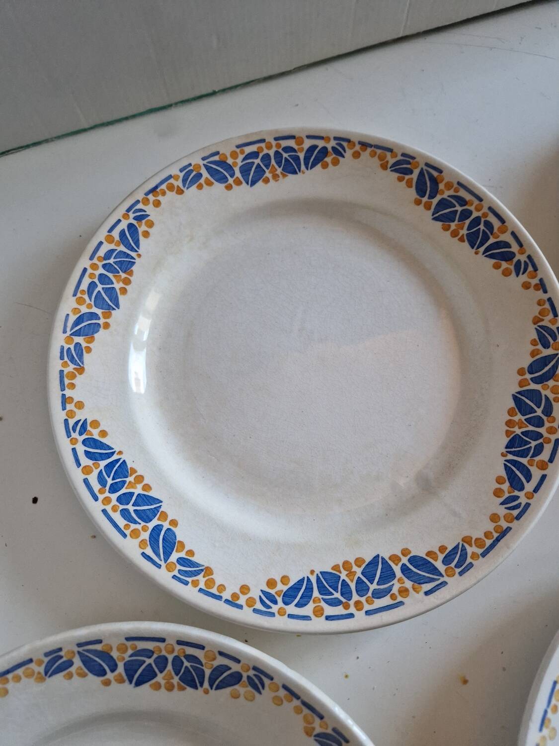 Set of 12 antique Art Deco plates, earthenware from Creil Montereau.