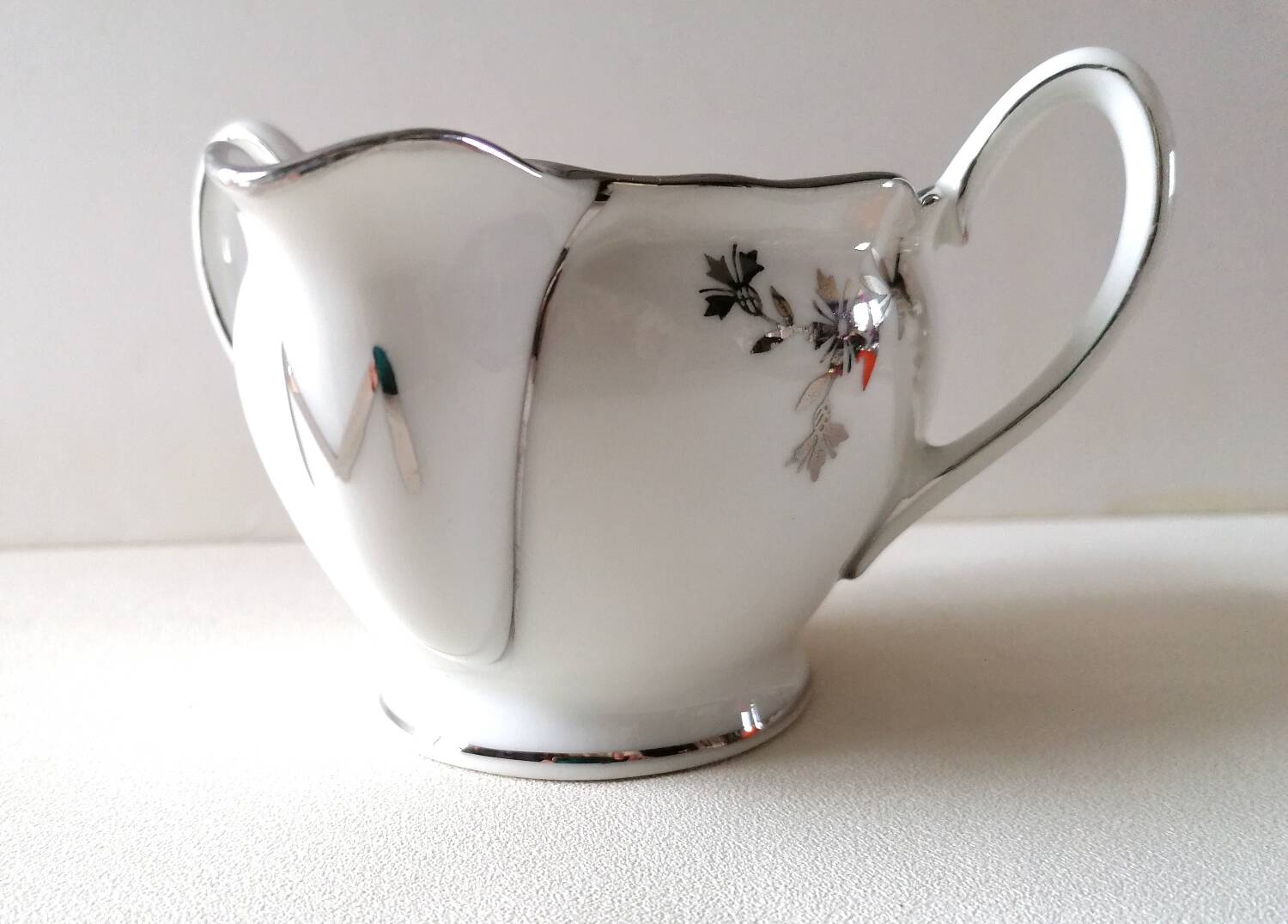 Limoges Maigre Gras porcelain sauce boat with silver decoration