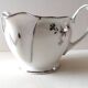 Limoges Maigre Gras porcelain sauce boat with silver decoration