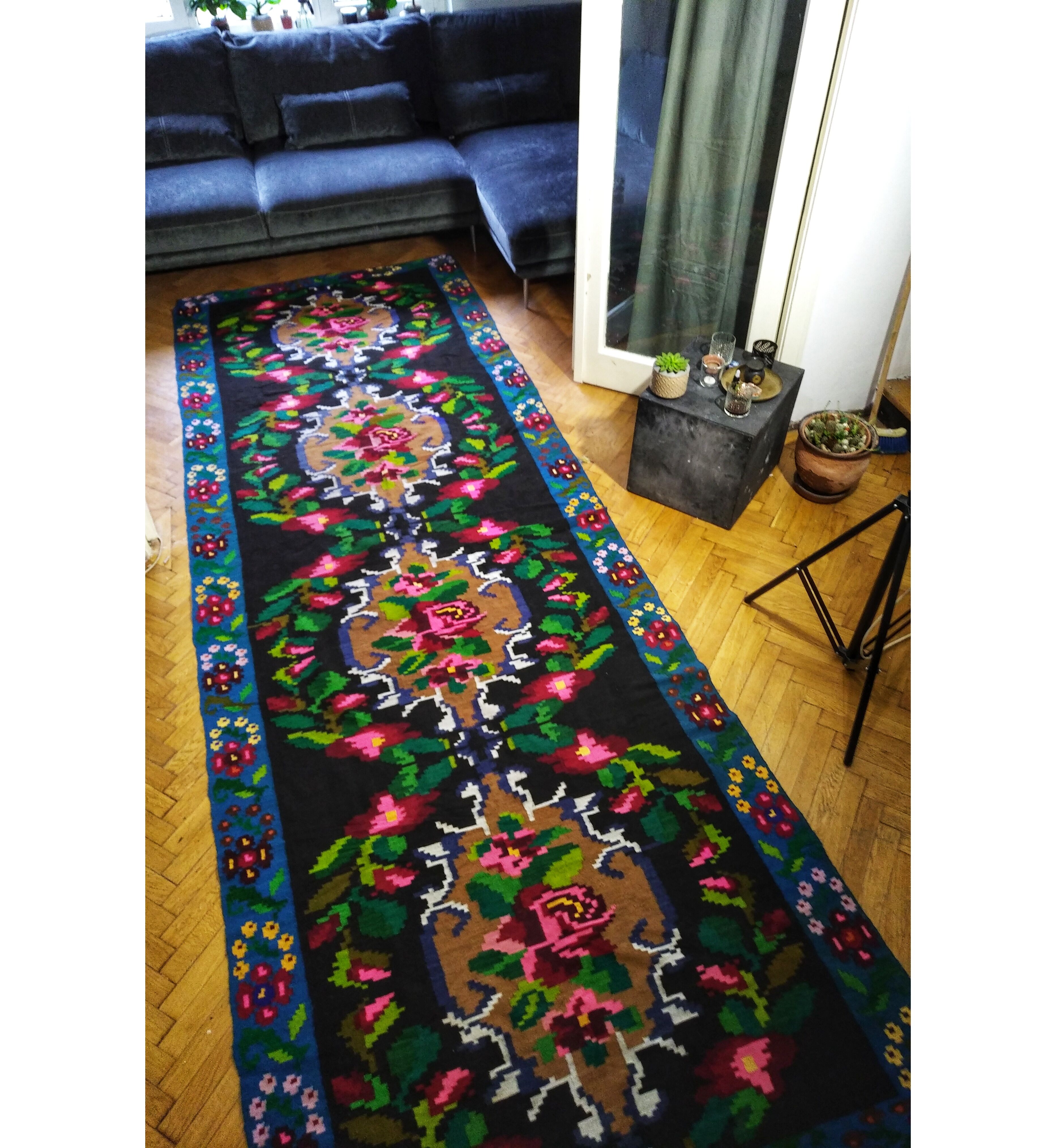 Romanian floral runner rug on blue background