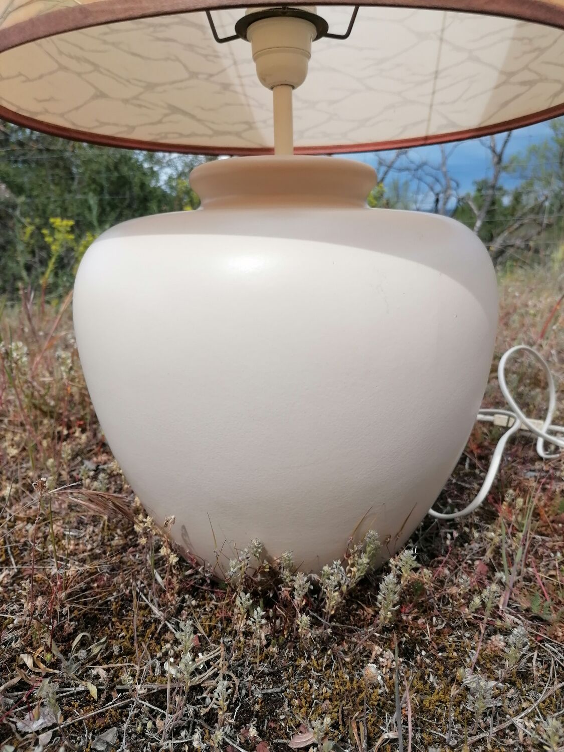 Vintage ceramic table lamp and golden lampshade.