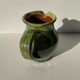 Green glazed ceramic pitcher