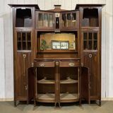 Art Nouveau mahogany buffet with clock in the style of G. Serrurier Bovy.