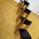 4 Scandinavian chairs in teak and black faux leather.