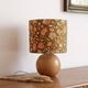 Table lamp with a wooden ball base, floral print in bohemian style.