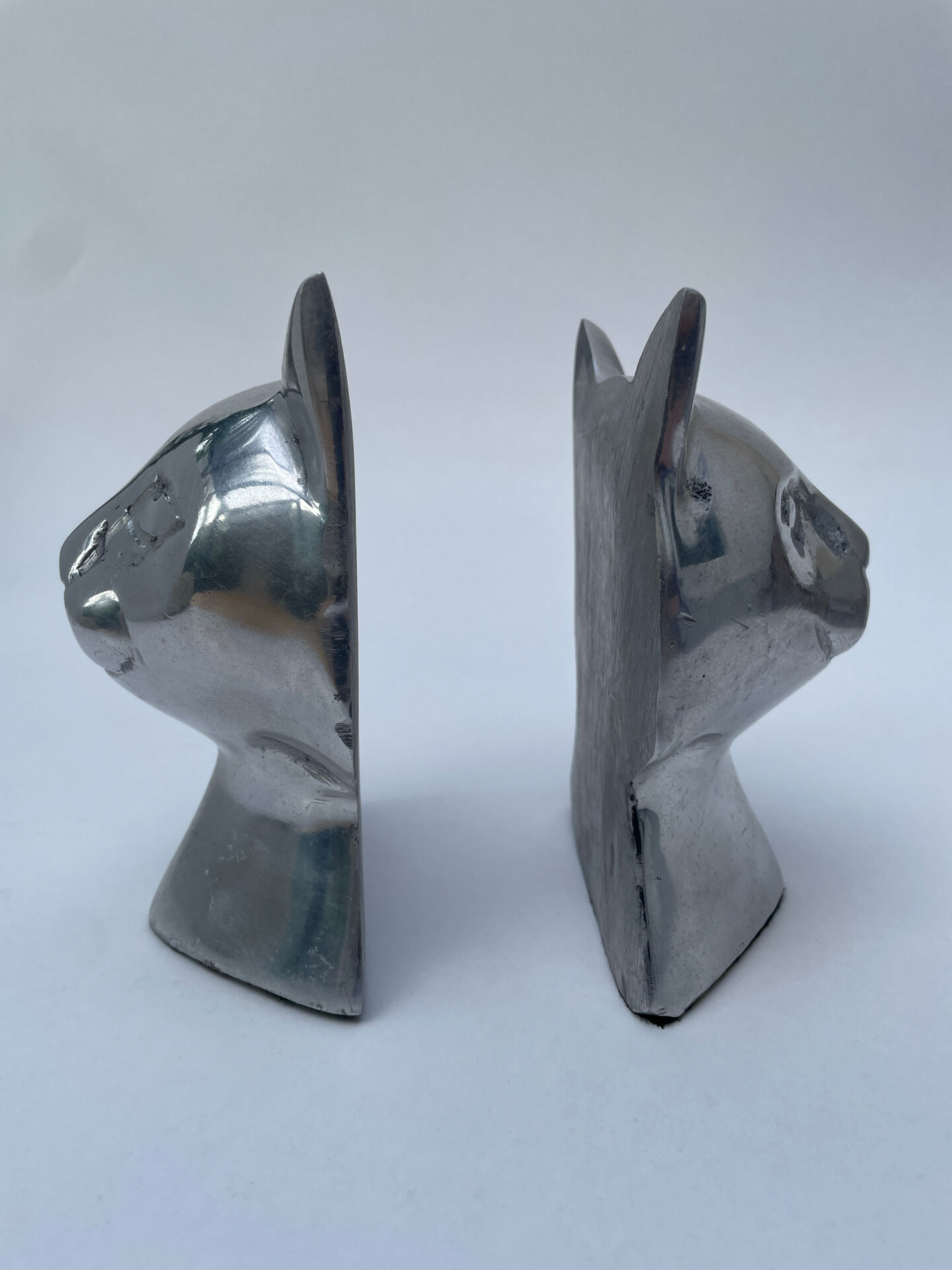Pair of designer cat head bookends