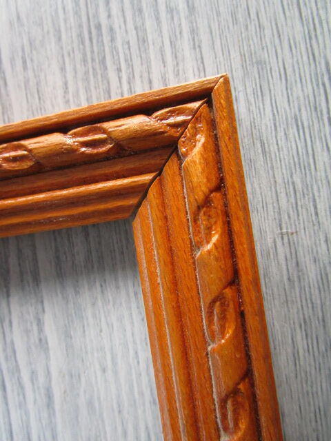 Old frame in worked wood