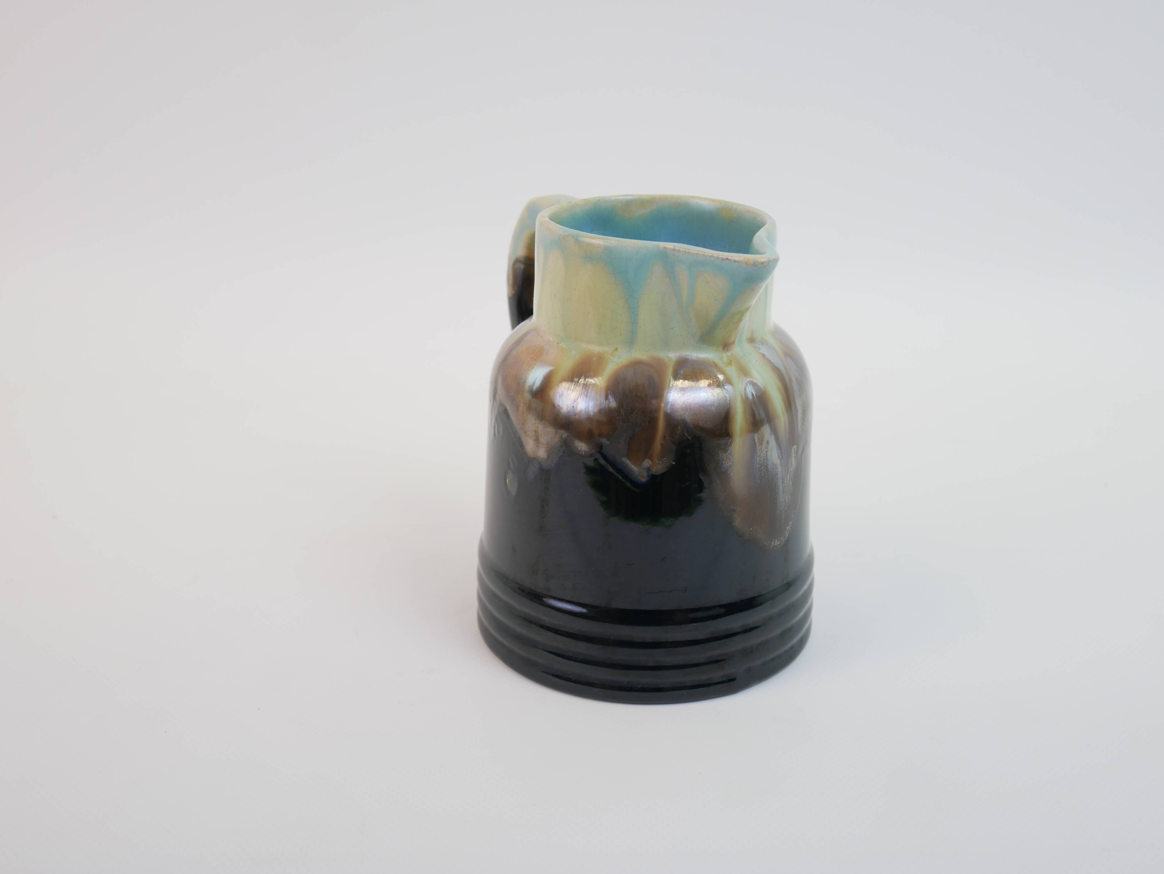 Art Deco pitcher in black, brown and blue glazed ceramic