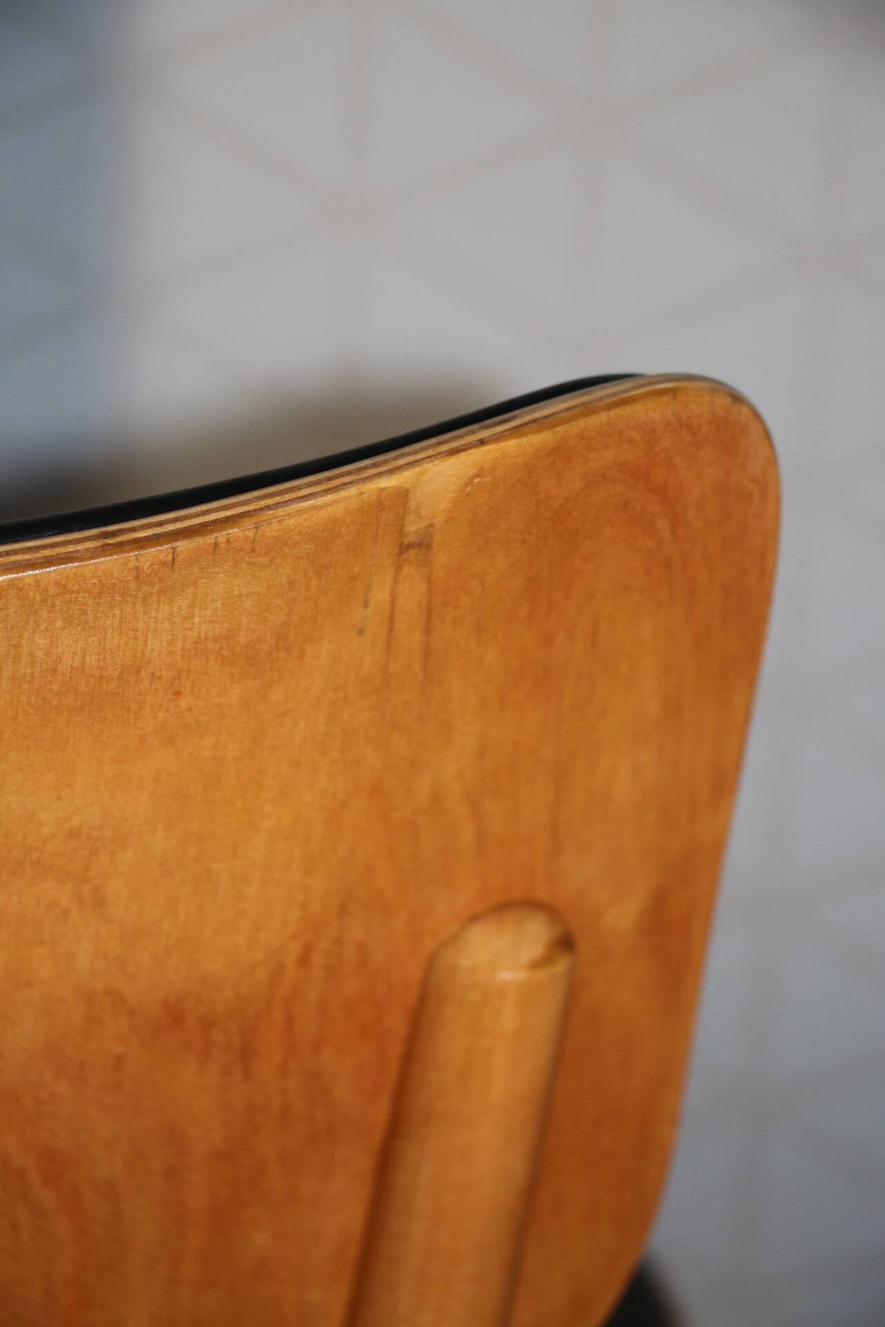 5 baumann chairs with large backs in black faux leather.