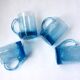 Four Biot glass mugs blue bubbled glass