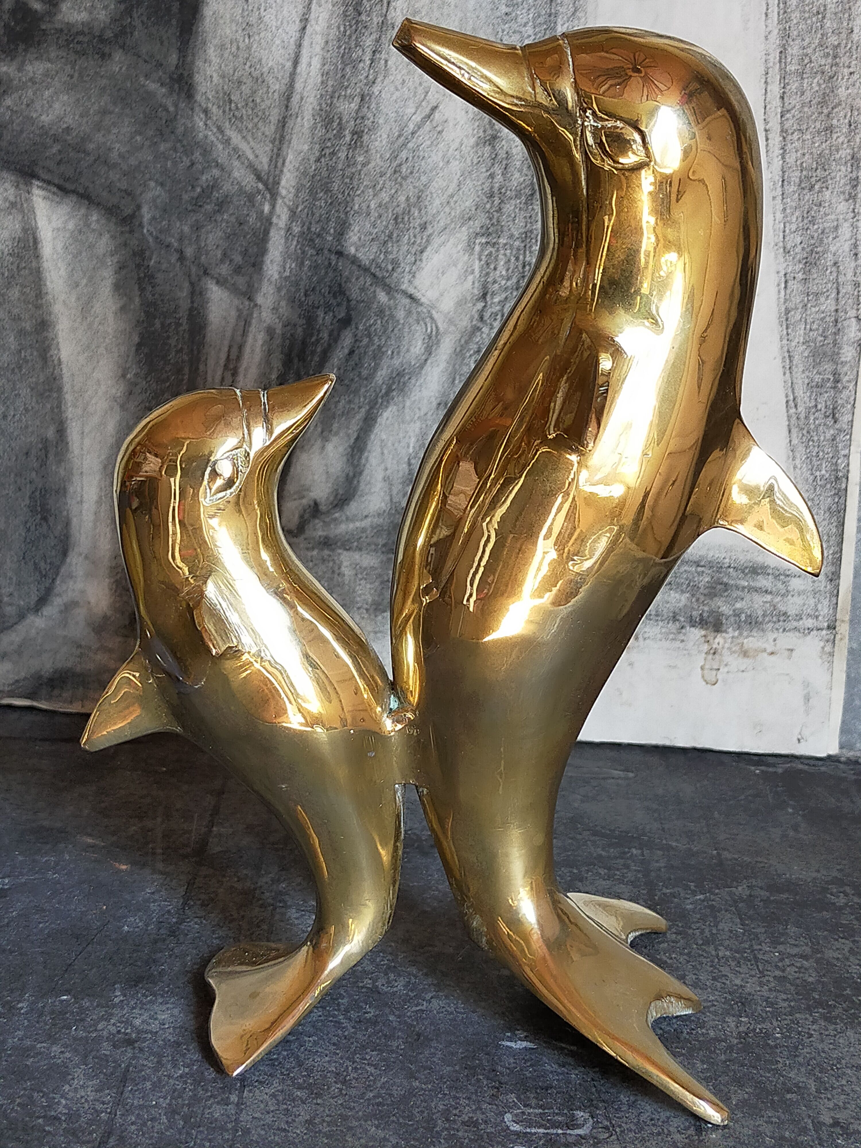 Vintage solid brass dolphins