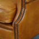 Cow leather wingback chair finished with decorative nails