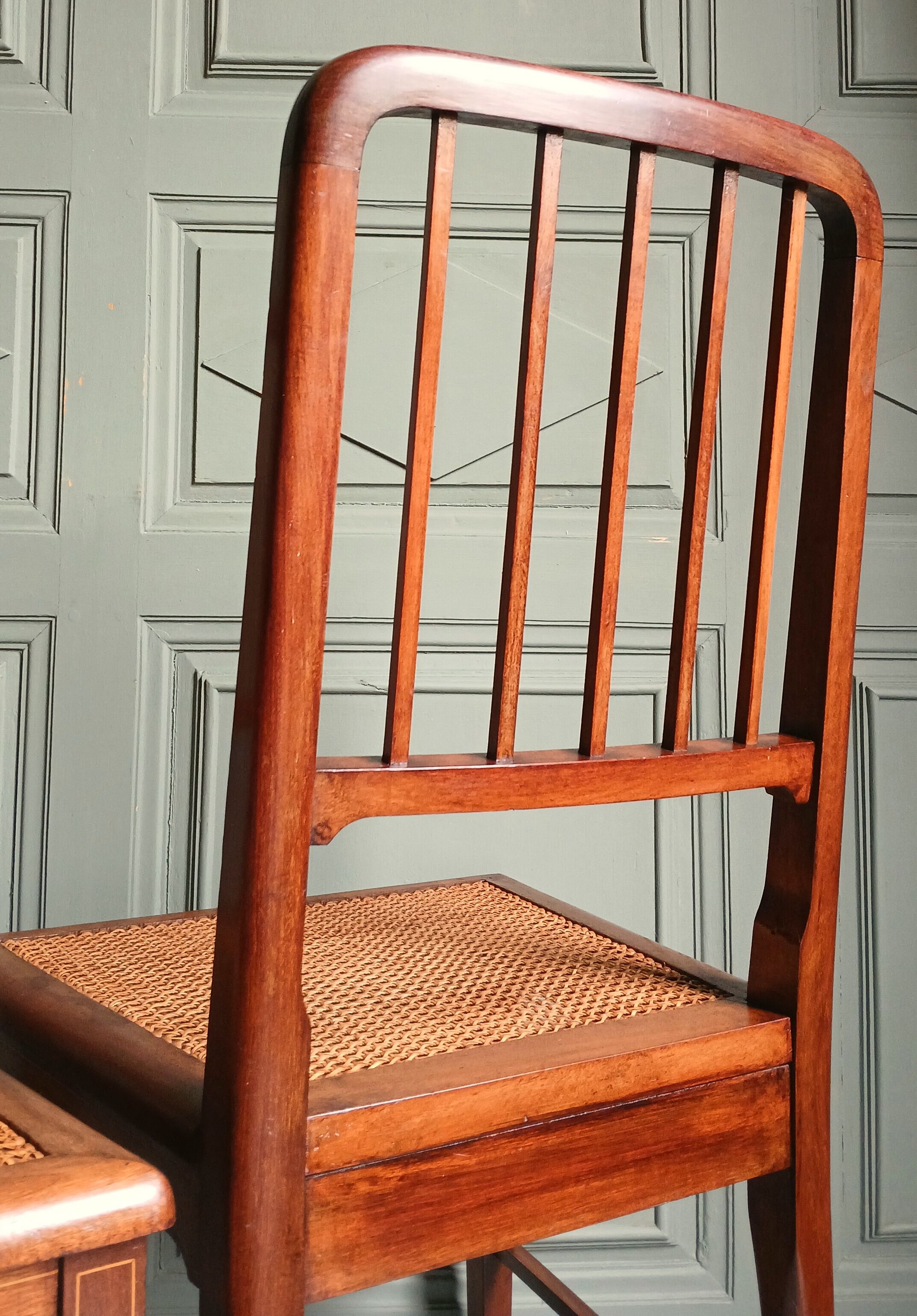 Pair of caned mahogany chairs, circa 1930.