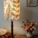 Aged metal table lamp, botanical shade