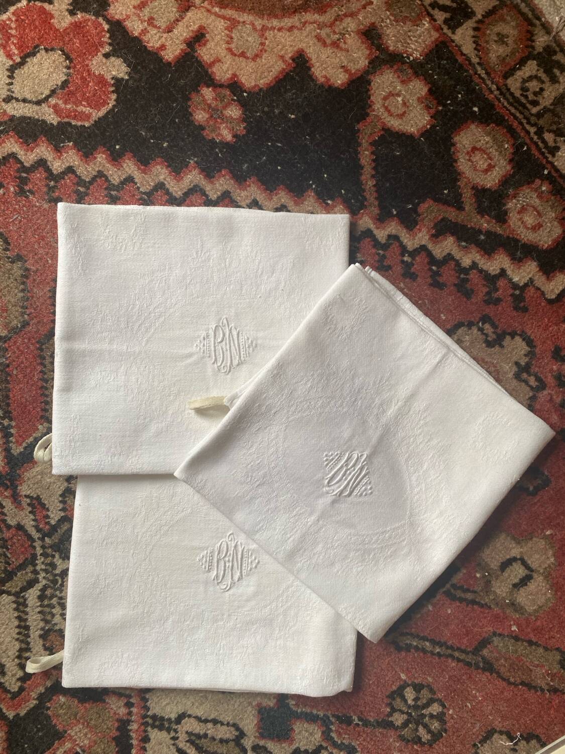 3 white tea towels in damask cotton thread with BN monogram.