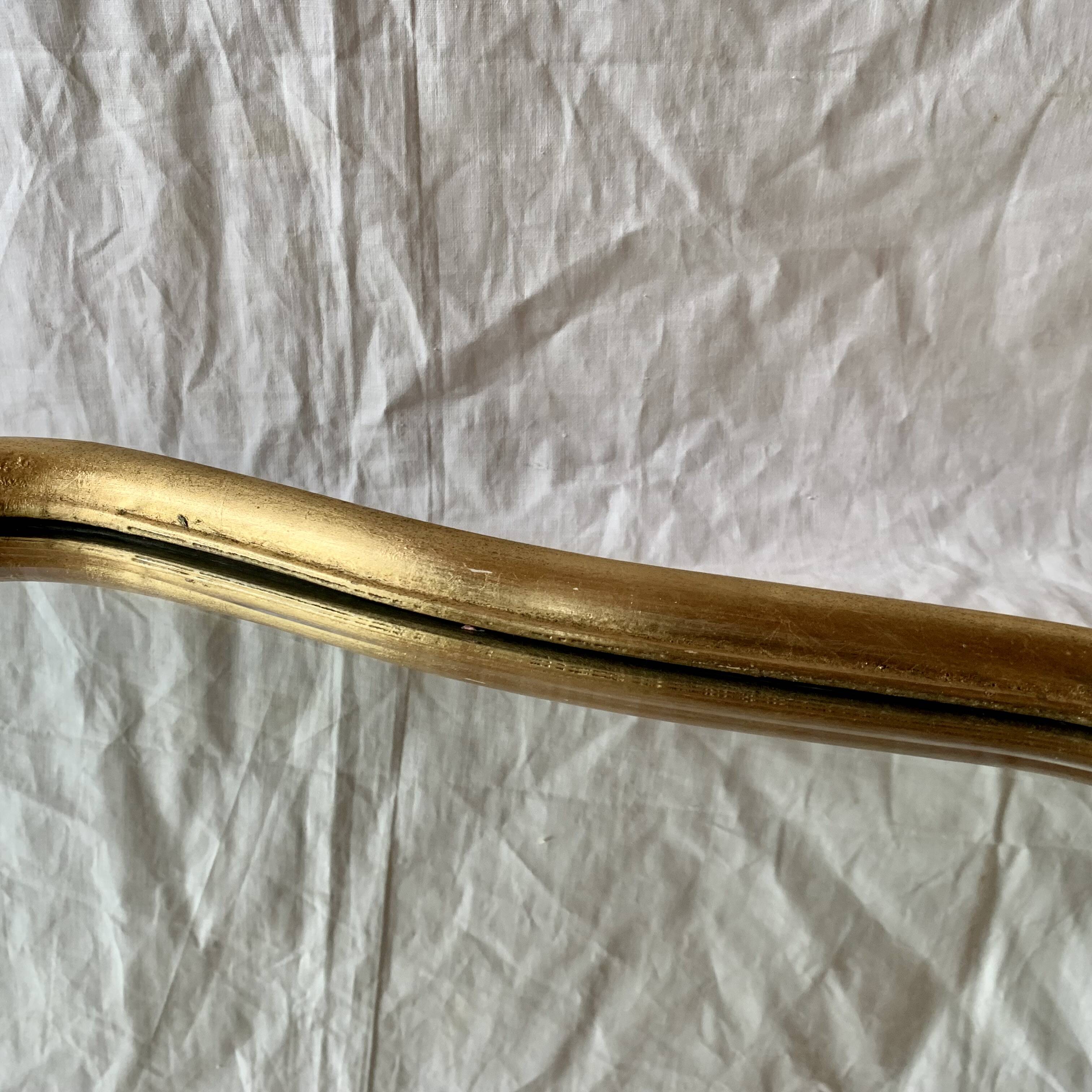 Antique beveled wall mirror in gilded solid wood