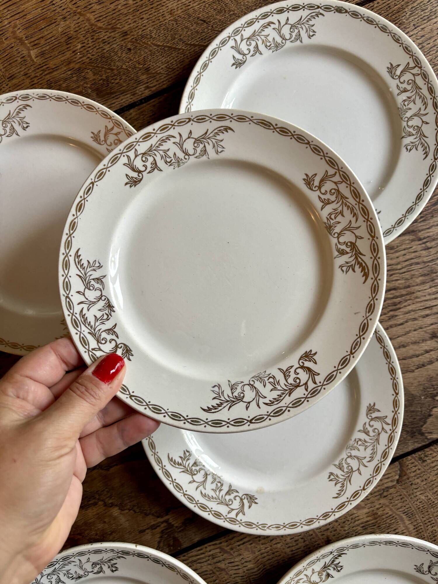 Set of 8 vintage white and gold dessert plates.