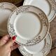 Set of 8 vintage white and gold dessert plates.