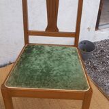 lot of 2 wooden chairs and green velvet