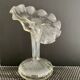 Vintage transparent glass vase in flower shape.