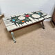 Vintage coffee table from the 60s and 70s in ceramic, chrome metal, and wood.