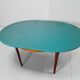 Extendable oval teak dining table