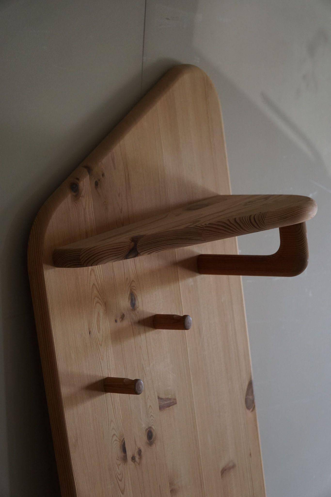 Sculptural wall coat rack in modern Danish design, made of solid pine, 1980s.