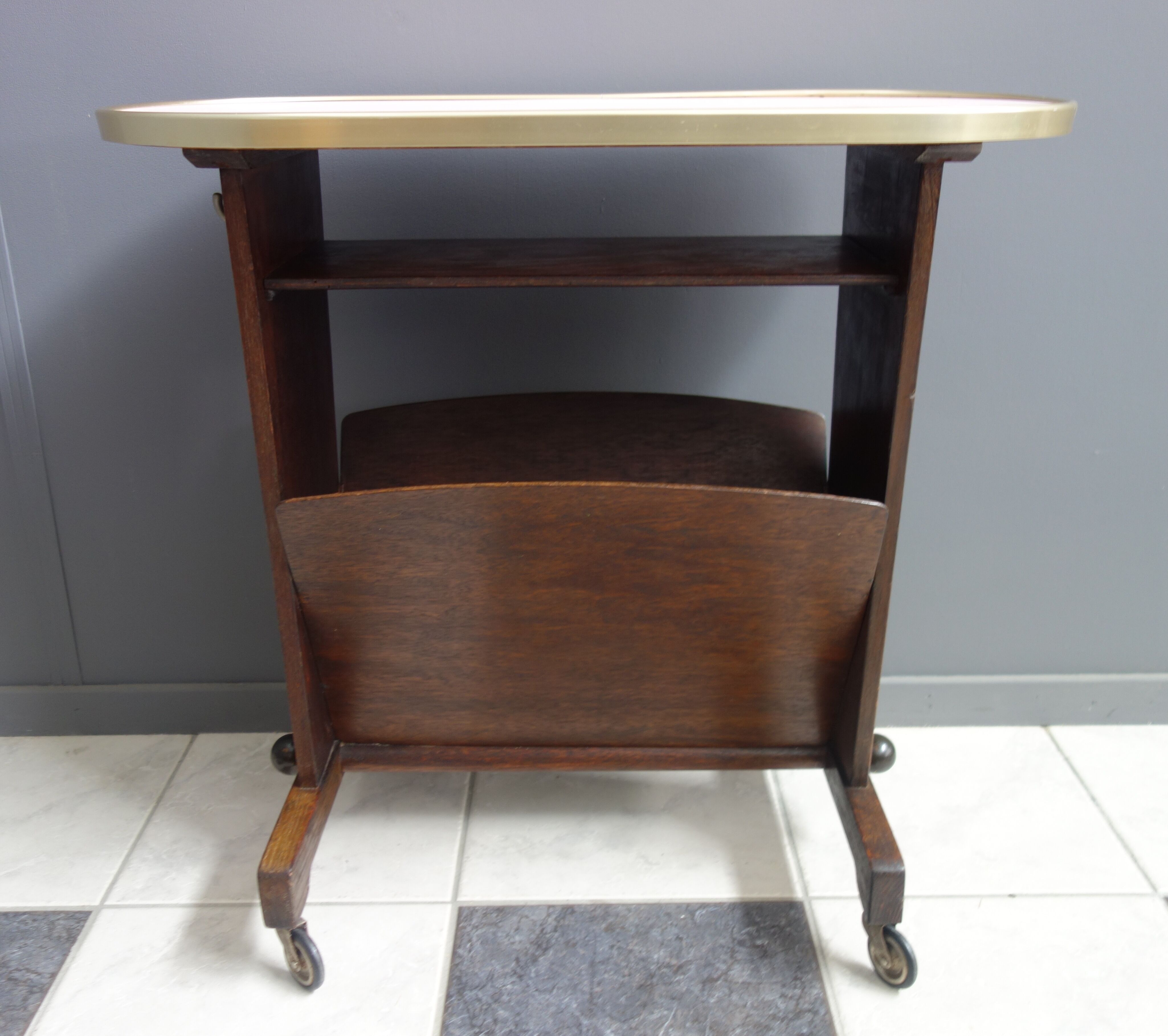 Pink formica magazine table 1950s