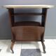 Pink formica magazine table 1950s