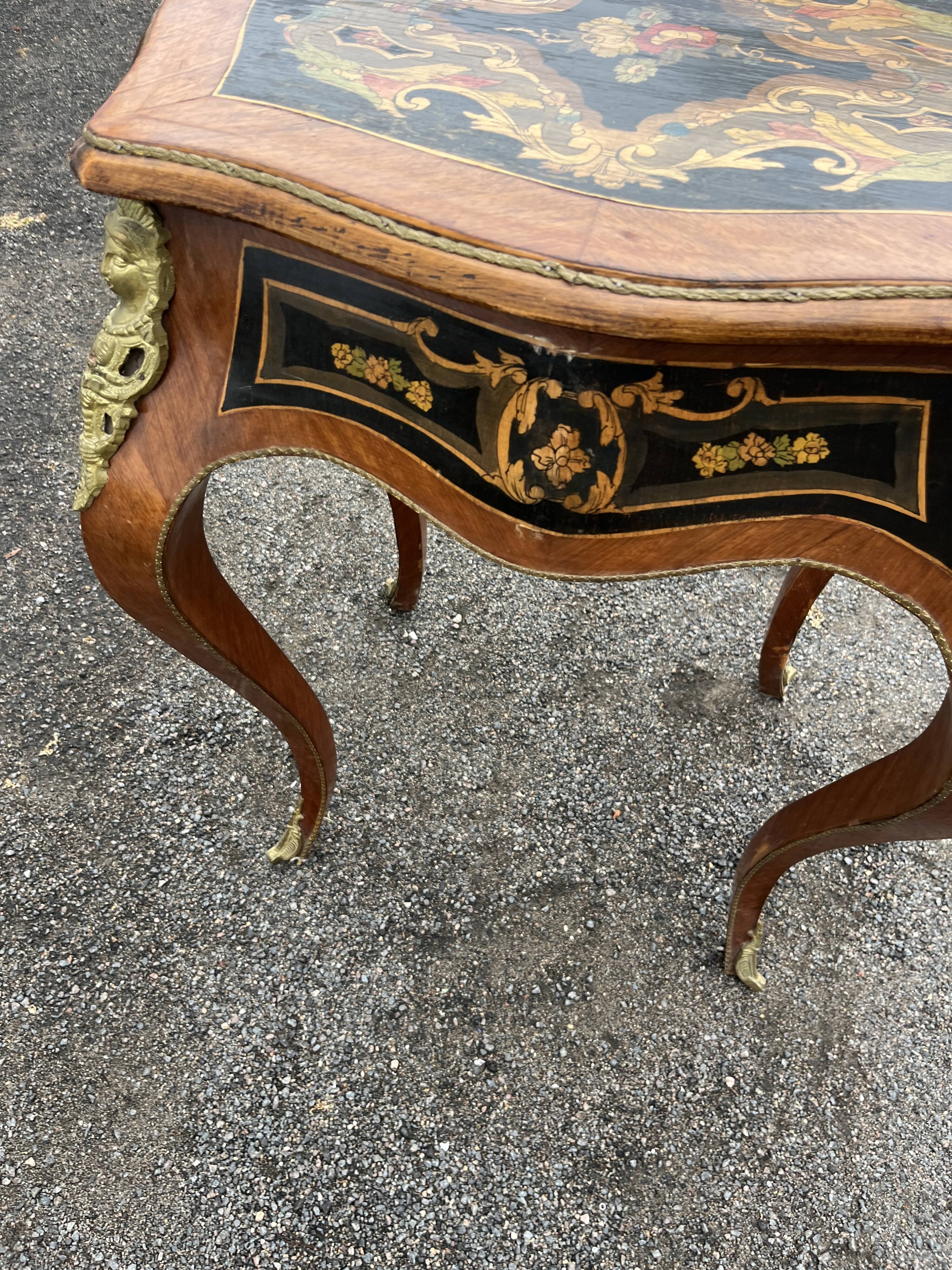 Louis XV style side table with marquetry and gilded bronze.