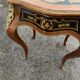 Louis XV style side table with marquetry and gilded bronze.