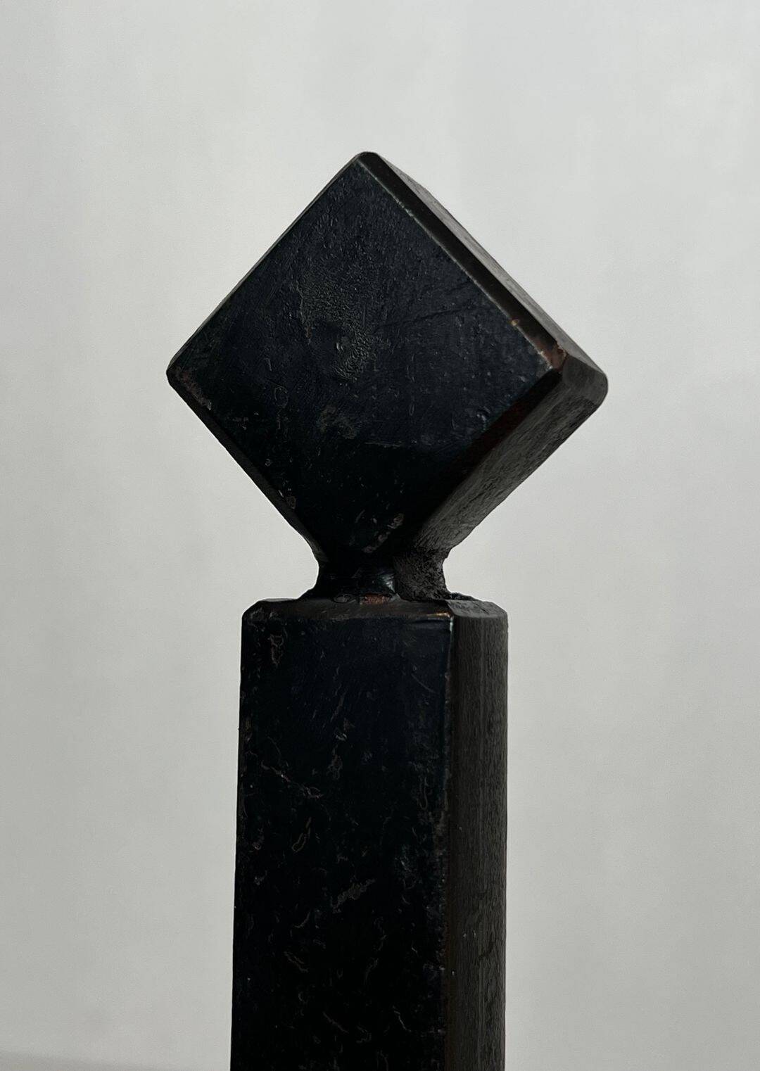 Pair of Modernist Black Iron Andirons with Diamond Finials and Angled Bases
