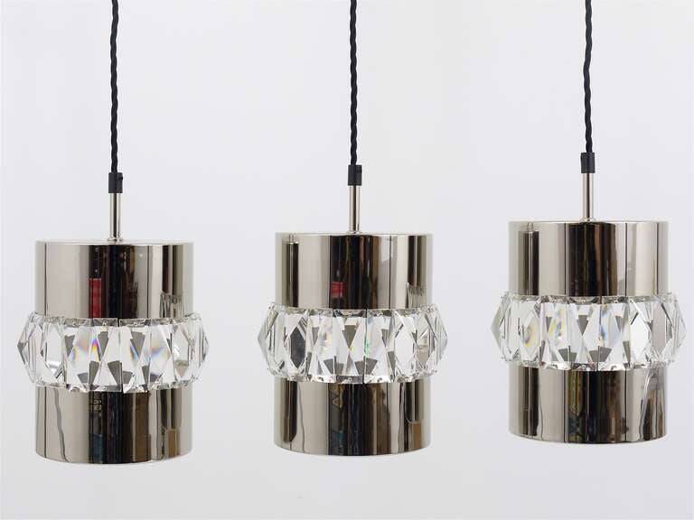 Three Bakalowits pendant lamps in nickel, brass, and faceted crystal, Austria, 1950s.