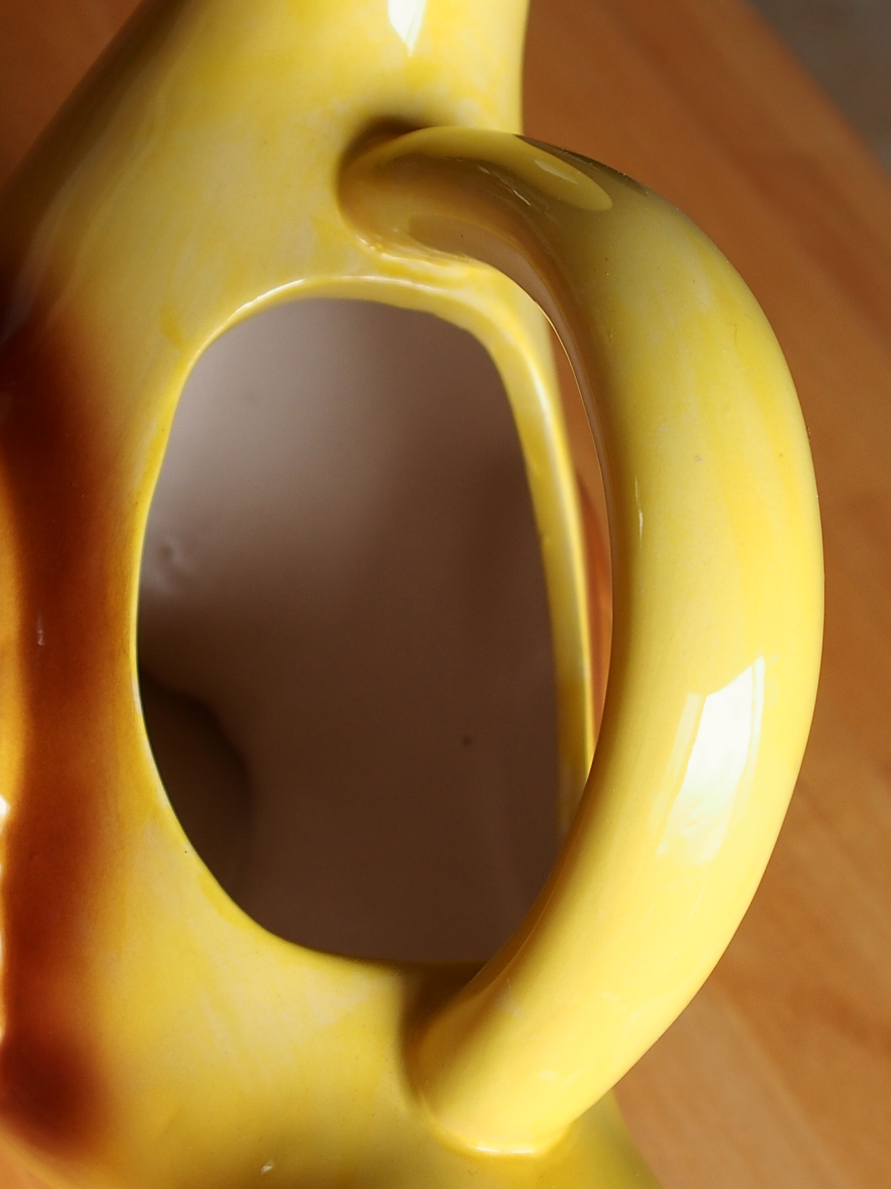 Ceramic watering can in white earthenware, yellow enamel and bird shape