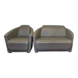 Two-seater sofa and a grey leather armchair Italia.