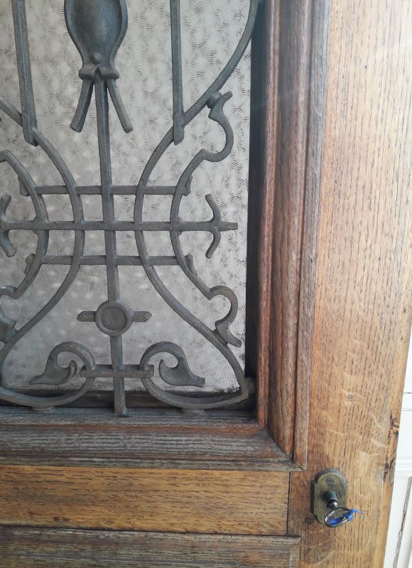 Old entrance door, glazed oak cast iron grilles 1925